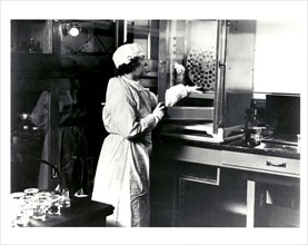 Female Researcher working in a medical research laboratory in 1937.