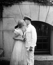 Man and woman kissing at U.S. Naval Academy