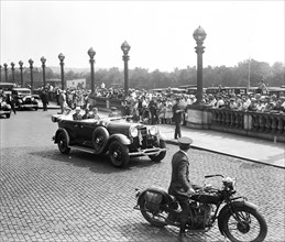 Automobile and crowd outside Union Station