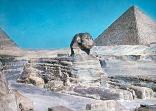 Original Caption:  Cairo and the pyramids