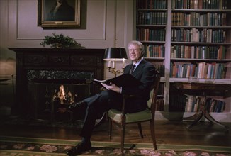 Jimmy Carter delivers his Fireside Chat from the library in the White House.