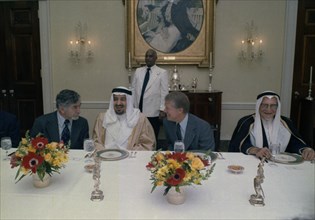 Jimmy Carter hosts a luncheon for King Khalid of Saudi Arabia.