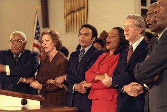 Jimmy Carter and Rosalynn Carter sing with Martin Luther King Sr.
