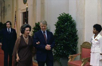 Jimmy Carter escorts Ladybird Johnson to the Panama Canal Treaty Dinner.