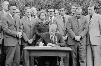 Jimmy Carter signs the Housing and Community Development Act.