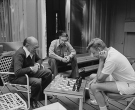 Menachem Begin and Zbigniew Brzezinski play chess at Camp David.
