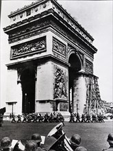 German soldiers marching past the Arc de Triomphe in Paris