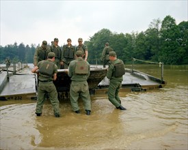 1978 - A ribbon bridge is assembled by members of the 1457th Engineering Battalion