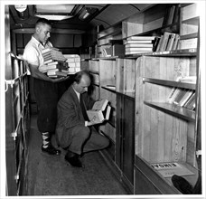 Returning Books to their Places Inside the Bookmobile