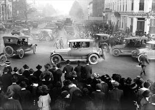 Cars on a busy city street ca. 1917