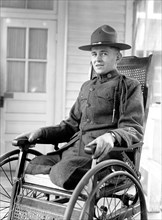 Soldier who lost his legs in World War I in his wheel chair ca. 1916