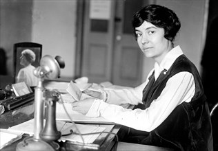 Woman working in an office in the early 1900s