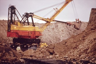 A Huge Shovel Digs Towards A Seam of Coal Off Route 800