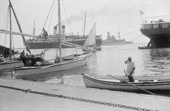 Suez Canal in Egypt, British warships and other boats at the entrance of the canal ca. between 1934 and 1939