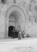 Entrance to the Armenian convent in Jerusalem, religious men in front of the convent ca. 1900