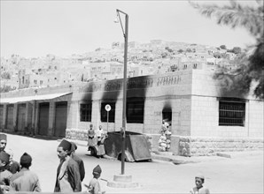 Hebron bank and post office burned by Arab rebels 8/19/1938