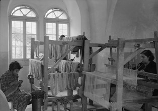Women's Institute, Jerusalem. One of the weaving rooms, women working on looms ca. between 1934 and 1939