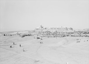 People walking at Neby Mousa [i.e., Nebi Musa] ca. 1900