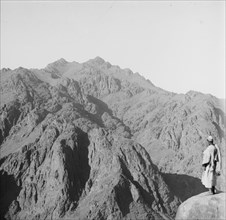 Man looking south; showing Jebel Katarina (Mount Catherine); Egypt ca. 1900