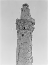 (Invisible Tower) Stork's nest on ancient minaret in Kifel or modern day Kifl Iraq ca. 1932