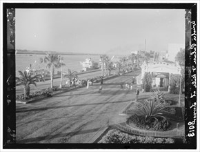 Egypt. Luxor. Nile from Winter Palace Hotel; showing a steam ship or steamer docked along the river ca. 1936
