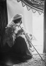 Profile image of Sheikh Abd El-Ftih holding a cane. ca. 1900