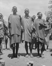 Wakikuyu types of men and women in Kenya, a Bantu ethnic group ca. 1936