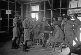Australian Army Y.M.C.A. in Julis Camp. Group of Australian soldiers listening to the radio ca. between 1940 and 1946
