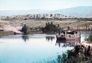 A ferry on the River Jordan, carrying horses ca. between 1950 and 1977
