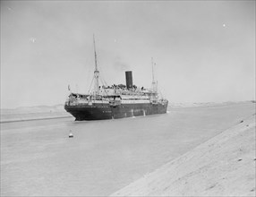 A steamship passing through the Suez Canal ca. 1920
