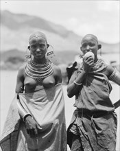 Traditional semi-nude Longido girls with large ear ornaments in Tanzania ca. 1936