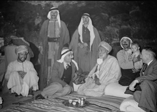 Guests being entertained in the house of a village elder in Daharieh ca. 1940