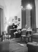Edith Matson seated at her desk in her home in Jerusalem ca. between 1930 and 1946