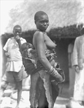 1930s Uganda Woman carrying child ca. 1936