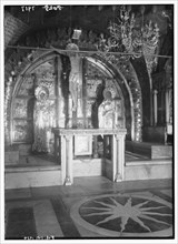 Interior of the Church of the Holy Sepulchre. Calvary altar with candles and decoration removed ca. 1934