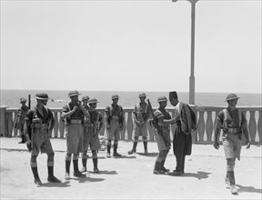Palestine disturbances 1936: Along the sea front of Jaffa, Palestinian citizens being searched by soldiers ca. 1936