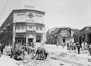 Workers clearing around city wall and digging sewage canals on Jaffa Road, Hotel Fast in the background ca. 1936