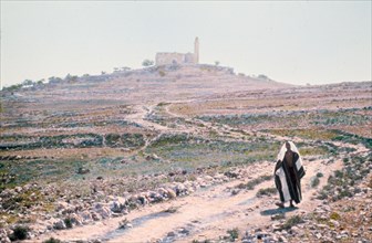 Man walking on road in an area near Jerusalem, possibly Mizpah (Neby Samwil)  ca. between 1950 and 1977
