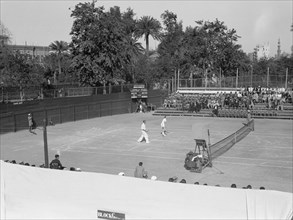 Gezira Gardens & Sports Club in Cairo Egypt, men playing on the tennis courts ca. between 1934 and 1939
