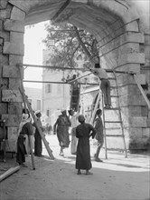 Workers Putting iron gates at the New Gate (Oct. 21, 1937) ca. 1937