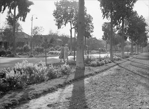 Two women walking at the Gezira Gardens & sports club ca. between 1934 and 1939