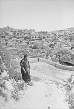 Man walking towards Jerusalem (El-Kouds), the approach to the city ca. 1900