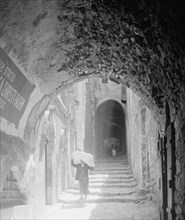 House of Veronica on Via Dolorosa 6th station of the Cross, people walking down the street ca. between 1940 and 1946