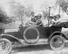 Women riding in an automobile ca.  between 1910 and 1920