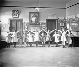 Young girls dancing or playing at William Lee's School, Georgetown, D.C.. ca.  between 1910 and 1920