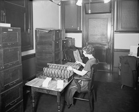 Woman working in an office ca.  between 1910 and 1920