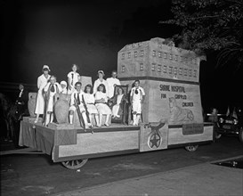 Shrine Hospital for Crippled Children float in a parade ca.  between 1910 and 1920