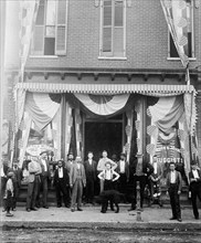 Men standing outside a druggist store ca.  between 1910 and 1935