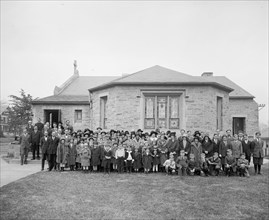 Group of children pose for a photo outside a Lutheran Church ca.  between 1910 and 1925