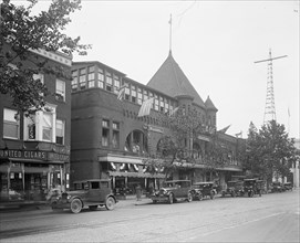 Cars parked outside the Arcade Market grocery store ca.  between 1910 and 1925